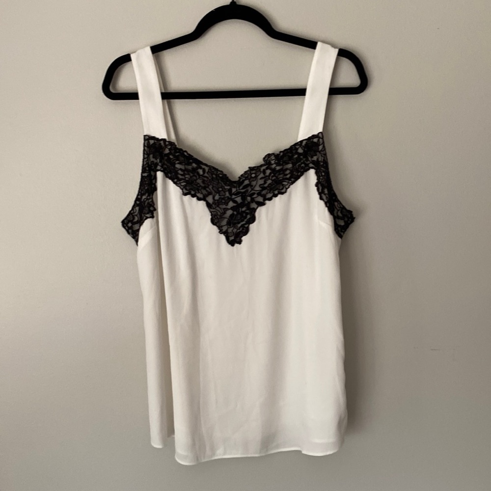 Off-white camisole with black lace trim.